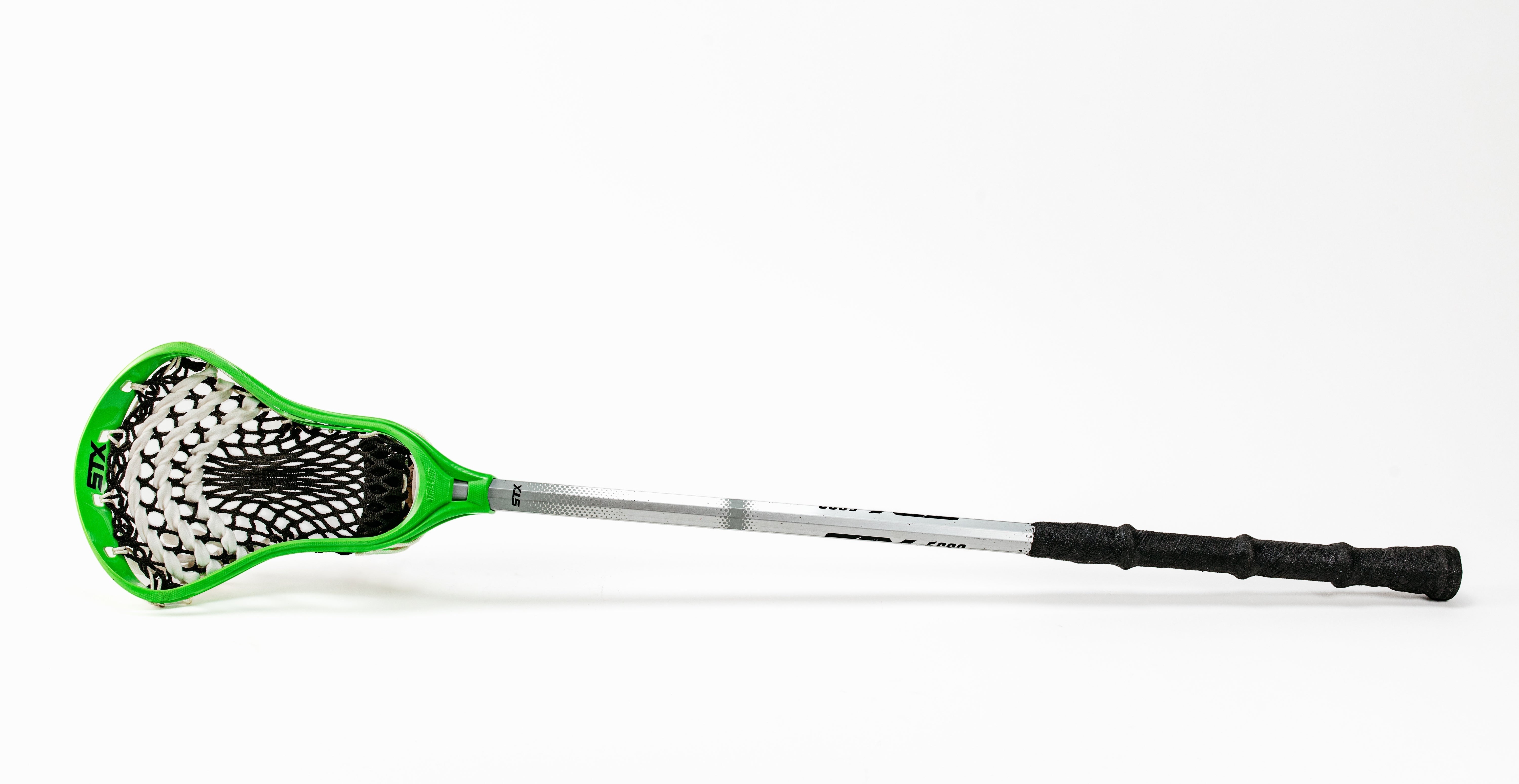 Fire Maul Tools green lacrosse stick with black grip tape and white mesh